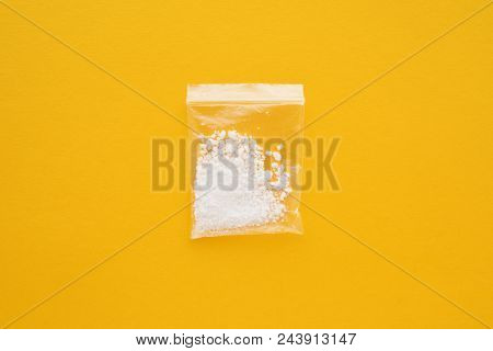 Cocaine Drug In Resealable Bag On Bright Yellow Background