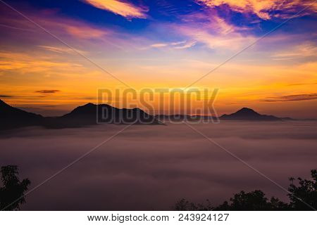Mountains Under Mist In The Morning With Sunrise At Phutoke Loei Thailand
