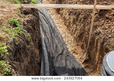 View Of Drainage Pipes And Inspection Well For Removal Of Water From A Site Under Construction Of Th