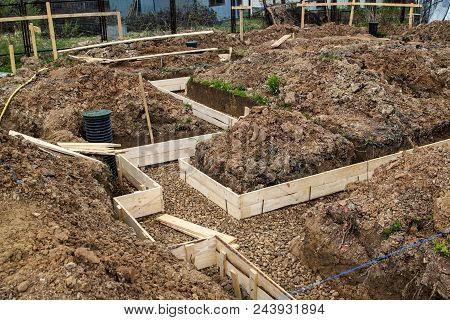 Inspection Well, Drainage Pipe And Trench With Formwork, Which Is Prepared For Pouring The Foundatio