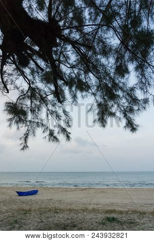 Blue Boat On The Sand Near The Sea In Thailand
