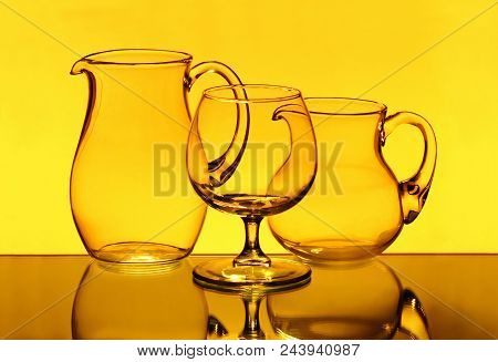 Wineglasses Three Orange Objects On Orange Background