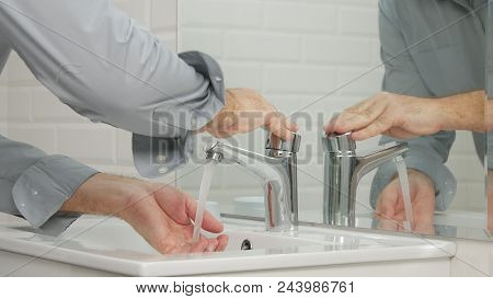 Man In Modern Bathroom Wash His Hands With Fresh Water Daily Hygiene Activity