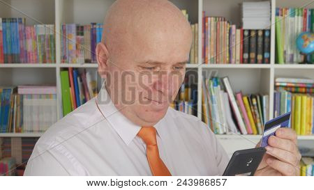 Businessperson Image Using Credit Card For A Mobile Financial Transaction