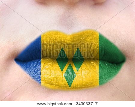 Female Lips Close Up With A Picture Flag Of Saint Vincent And The Grenadines. Learning Languages.