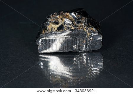 A Black Rock Also Called Healing Stone Shungite, Which Consists Mainly Of Carbon Was Photographed He