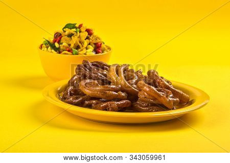 Jalebi And Traditional Indian Deep Fried Salty Dish Called Chivda Or Mixture Or Farsan