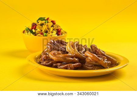 Jalebi And Traditional Indian Deep Fried Salty Dish Called Chivda Or Mixture Or Farsan