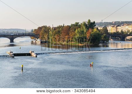 Strelecky Island With Weir On Vltava River Near National Theatre And The Charles Bridge, Prague, Cze