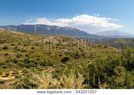 Scenic View At Landscape On The Westside Of Greek Island Rhodes With Green Vegetation In The Foregro