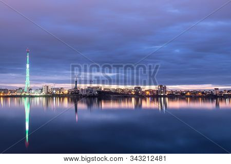 Long Exposure Photo Of A Beautiful Sunset At Lacul Morii Lake With Urban Buildings In The Background