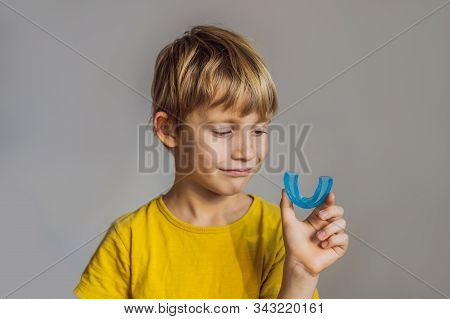 Six-year Old Boy Shows Myofunctional Trainer. Helps Equalize The Growing Teeth And Correct Bite, Dev