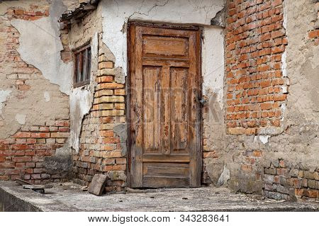 Vintege Door At The Ruined Remote Located House. Old Ruin Concept.