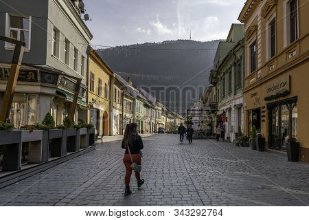 Brasov, Transylvania, Romania - November 18, 2019: Some People Walking Through Strada Michael Weiss,