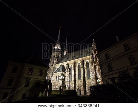 Brno Cathedral Of Saints Peter And Paul, Seen From The Bottow Of Petro Hill, At Night, Surrounded By