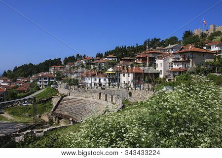 Antique Ancient Roman Amphitheater Or Antique Theatre Of Ohrid With View On Old Town Of Ohrid And La