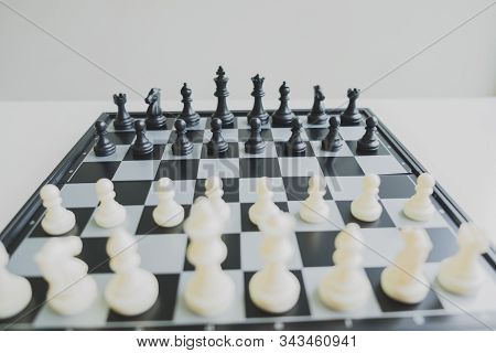 Chess Pieces On Board With White Background, Driven To Success Business Strategy.