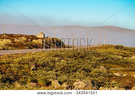 Road Crossing Hardangervidda Plateau, Norway Landscape. National Tourist Hardangervidda Route.