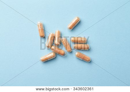 Goji Berry (wolfberry) Capsules. Immune System Support. Dietary Supplement On Bright Paper Backgroun