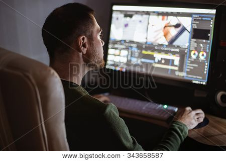 Video Montager Mounts Video At Desktop. Home Workstation