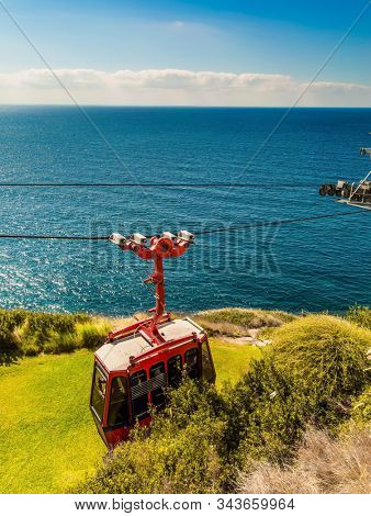Cableway for descent to sea caves and grottoes. The world's most steep red funicular in grottoes  Rosh a Nikra. Israel. The concept of active, eco and photo tourism