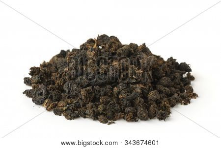 Pile of granular black tea isolated on white