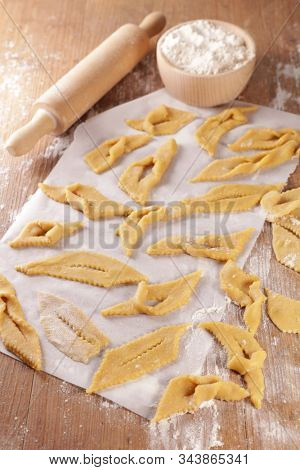 traditional french bugnes for carnival- raw dough and ingredient