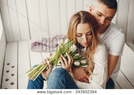 Cute And Elegant Family In A White Rom