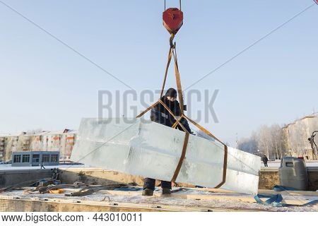 Portrait Of A Worker In A Black Hat Unloading