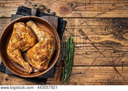 Bbq Grilled Chicken Legs In A Wooden Plate With Herbs. Wooden Background. Top View. Copy Space