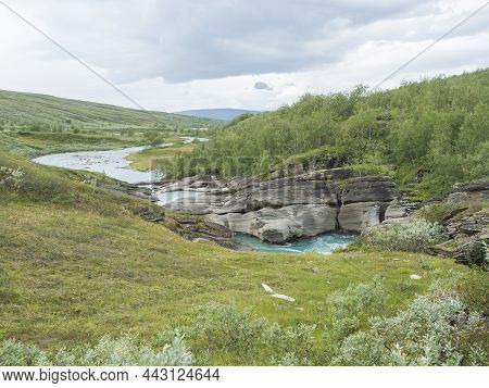 Valley With Winding Laddejahka River, Birch Tree Forest And Green Mountains. Lapland Landscape Swede