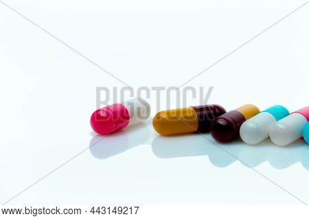 Multi-color Antibiotic Capsule Pills On White Background. Antibiotic Drug Resistance. Prescription D
