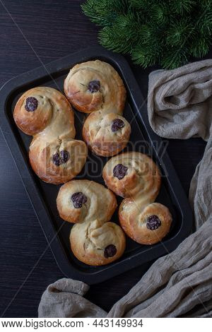 Swedish And Scandinavian Saffron Buns Lussekatter On A Table