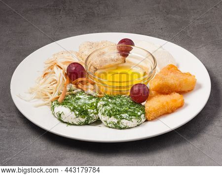 Tatsy Assorted Cheese In A Restaurant With Honey On A White Plate