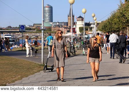 Dusseldorf, Germany - September 19, 2020: People Visit River Rhine Waterfront In Dusseldorf, Germany