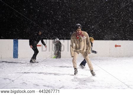 24.11.2021. Heavy Snowfall In Moscow. People With Children On An Ice Rink Near Tsaritsyno Park. High