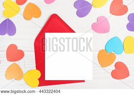 Mockup Card With Paper Colorful Hearts. Valentines Invitation Card On White Wooden Background, Flat 