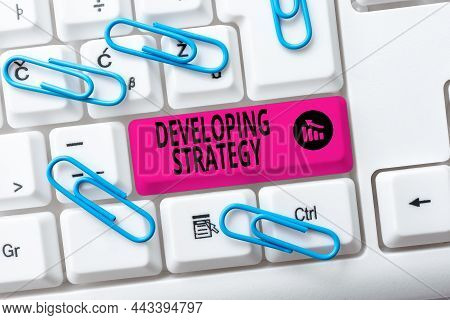 Handwriting Text Developing Strategy. Business Idea Organizations Process Changes To Reach Objective