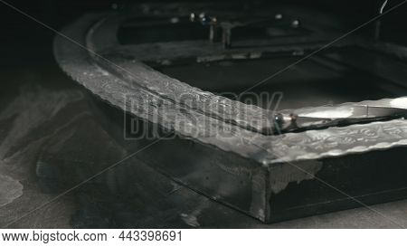 Forge Workshop. Smithy Manual Production. Polish Metal With An Angle Grinder With An Abrasive Nozzle