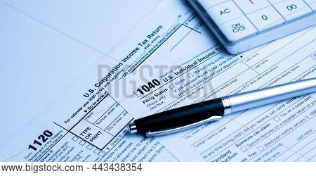 Income Tax Form And Pen. Finance Concept.
