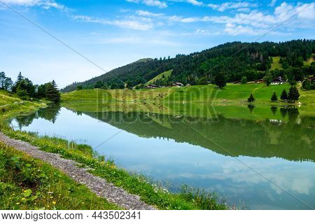 Lake Of The Confins And Mountain Landscape In La Clusaz, Haute-savoie, France
