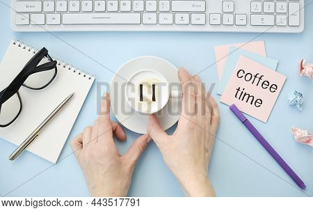 Coffee Break. Female Hands Touches White Cup Of Classic Coffee, Top View, Close Up. Pause Icon On Fo