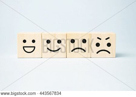 Wooden Blocks With The Happy Face Smile Face Symbol Symbol On Blue Background, Evaluation,