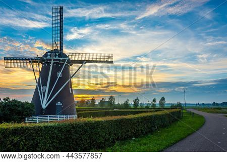 Old Dutch Windmill By The Sunset In Etten-leur, North Brabant