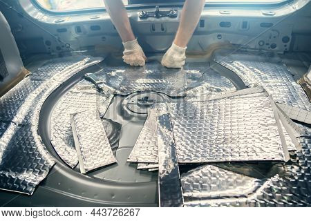 Auto Service Worker Installs Soundproofing Material Inside Car Interior, Soundproofing Insulation.