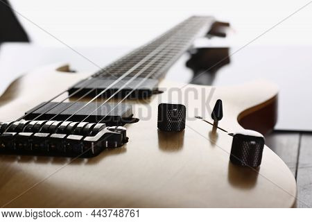 Close-up Of Classic Shape Wooden Electric Guitar With Rosewood Neck. Six Stringed Learning Lesson Mu