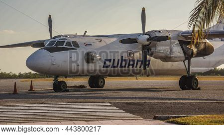 Cuba, February 2012, The Plane Of The Cuban Airlines On The Takeoff Field During The Sunset Against 