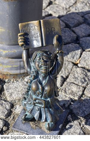 Wroclaw, Poland - September 30, 2021: Dwarf Women Symbol Of Democracy With The Constitution Rp In Ha