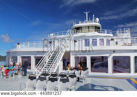 Bjornafjord, Norway - July 23, 2020: Passengers Ride On A Car Ferry Crosses Bjornafjord In Norway. P