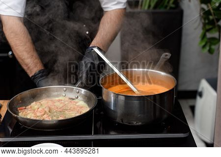Cooking Process Of Suquet De Peix Soup With Potatoes, Herbs And Fish With The Addition Of Picada Clo